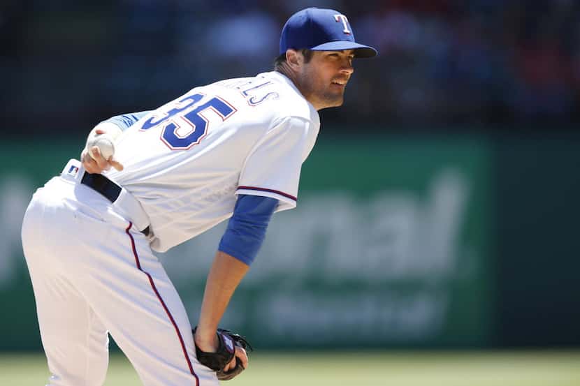 Texas Rangers starting pitcher Cole Hamels (35) prepares to pitch in a game against the Los...