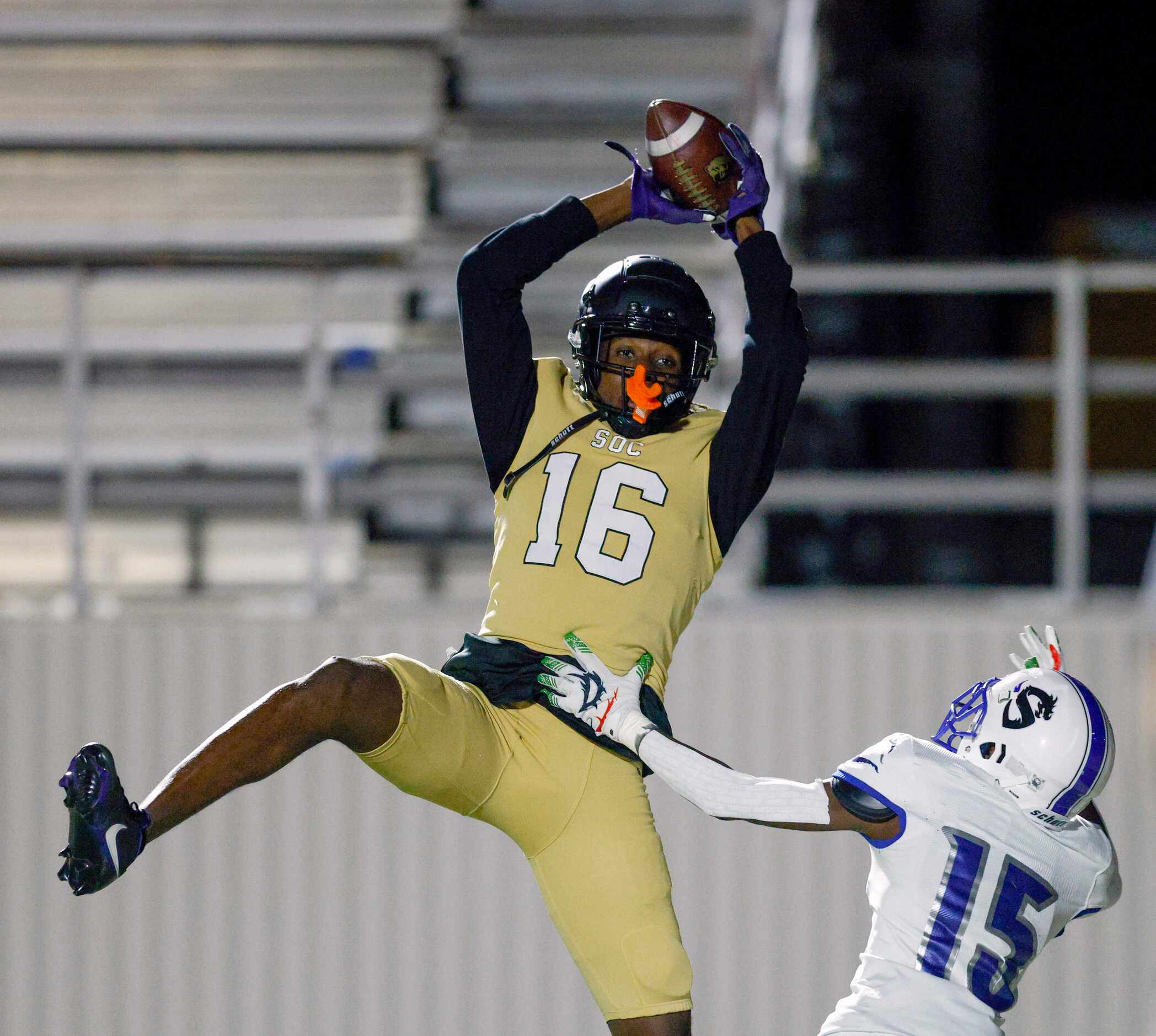 South Oak Cliff wide receiver Trey Jackson (16) makes a leaping catch for a touchdown over...