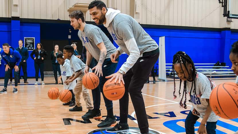 Dallas Mavericks basketball players and local children at Hoop Camp
