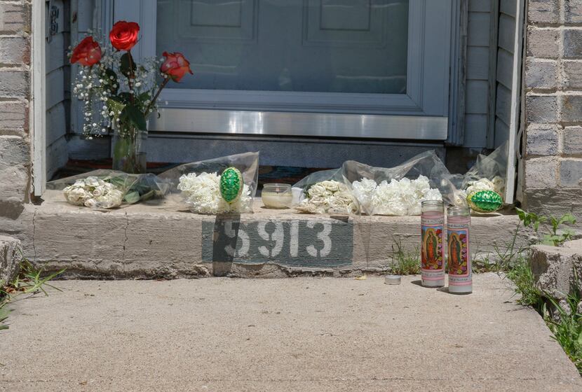 A small memorial is starting to form on the front step of 5913 Mimosa Lane in Rowlett, Texas...