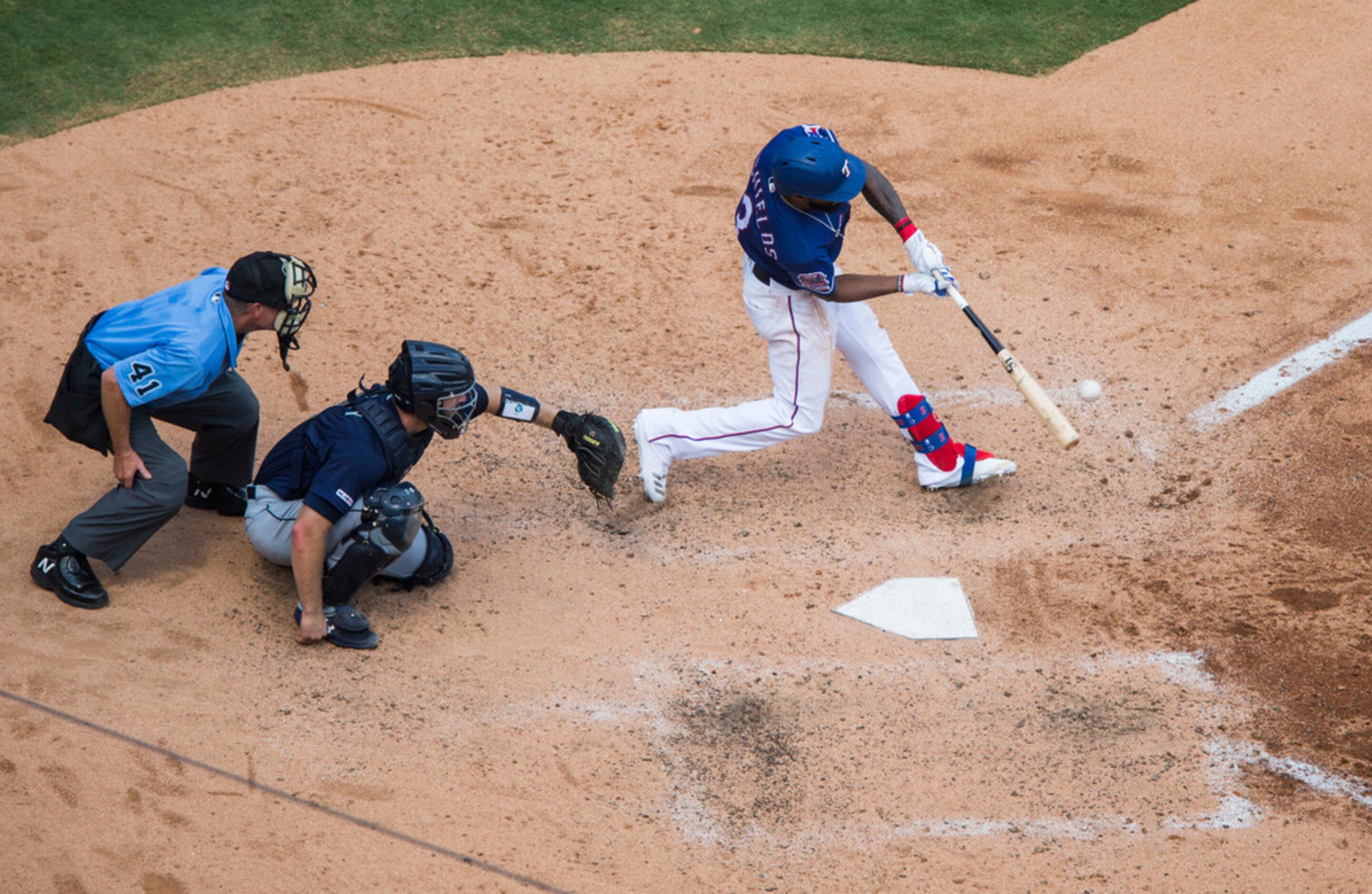 Texas Rangers center fielder Delino DeShields (3) bats during the fifth inning of an MLB...