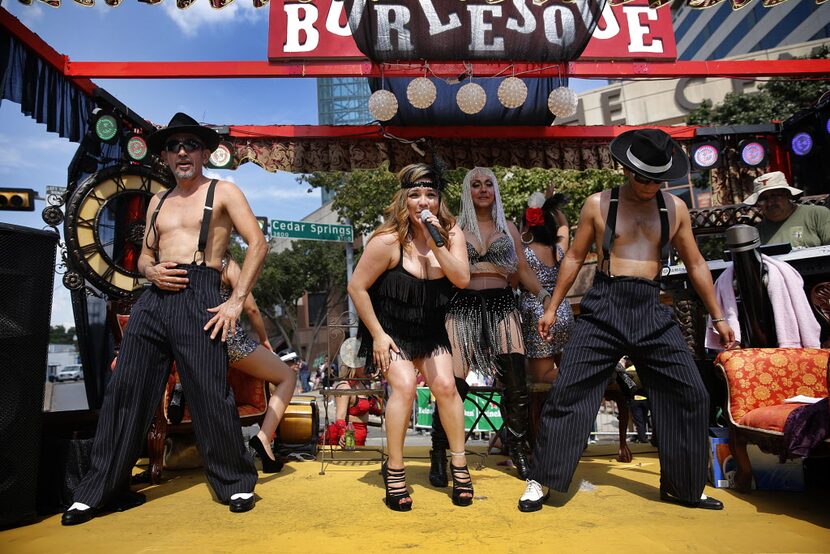 Performers on the Casa Blanca Burlesque float entertain the crowd in the Alan Ross Texas...