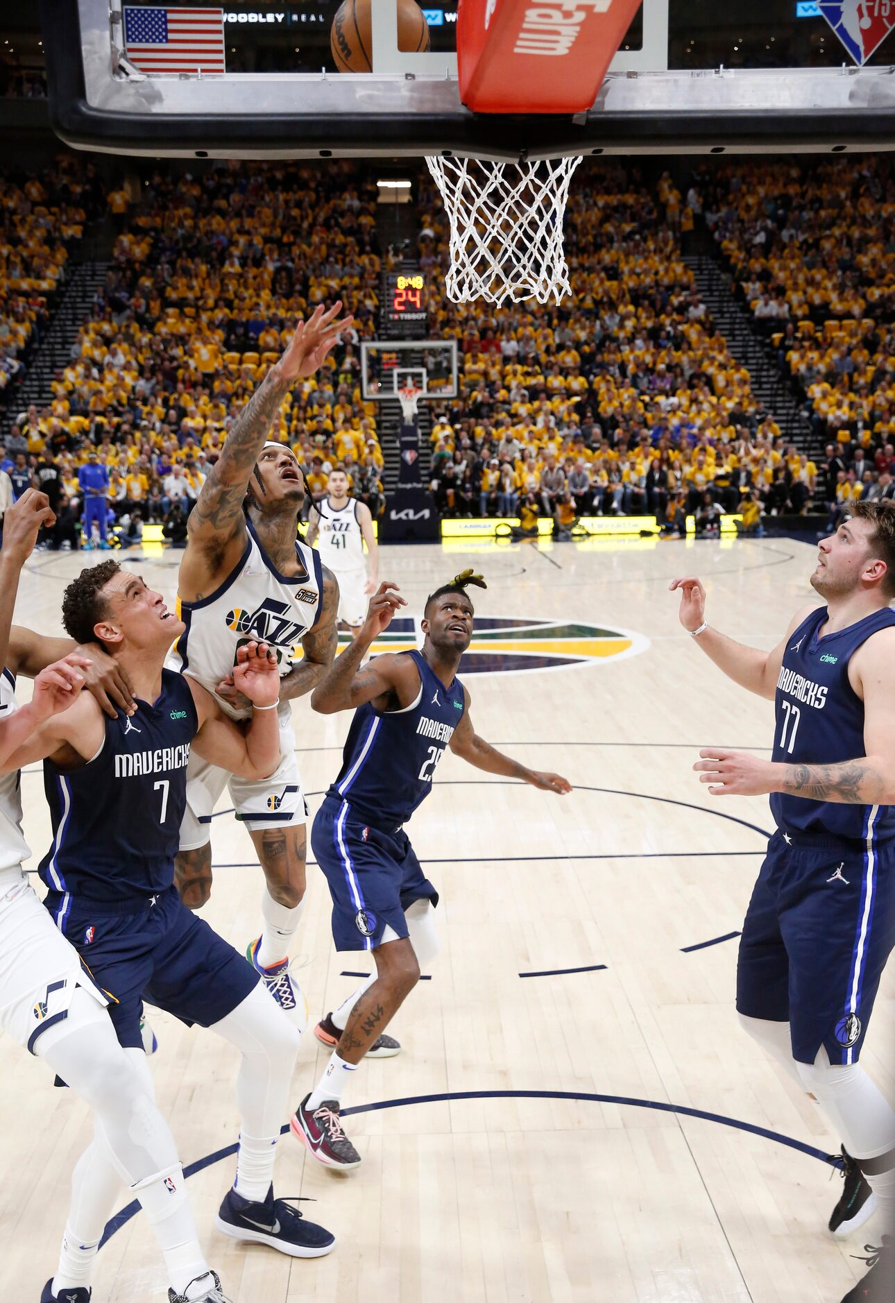 Utah Jazz guard Jordan Clarkson (00) attempts a shot in front of Dallas Mavericks center...