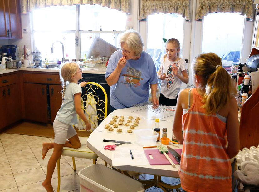 Summer Garmon, 6, (from left) looks at her grandmother Peggy Garmon with her sisters...