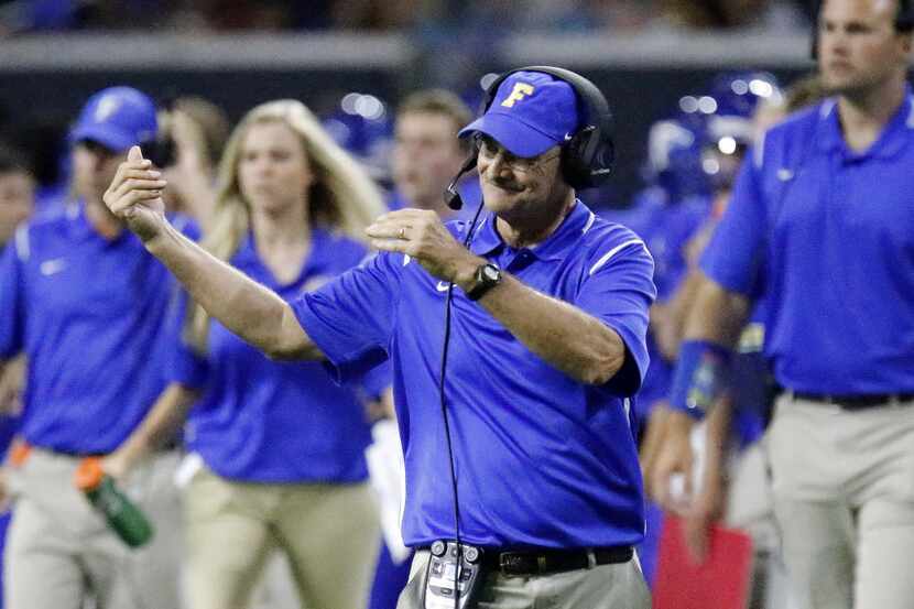 Frisco head coach Vance Gibson calls for one of his players between plays during the second...