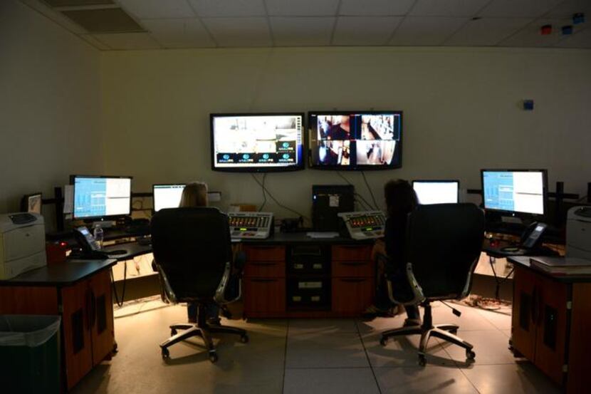 
Communication officers Heather Alford (left) and Teresa Wilson answer emergency calls at...