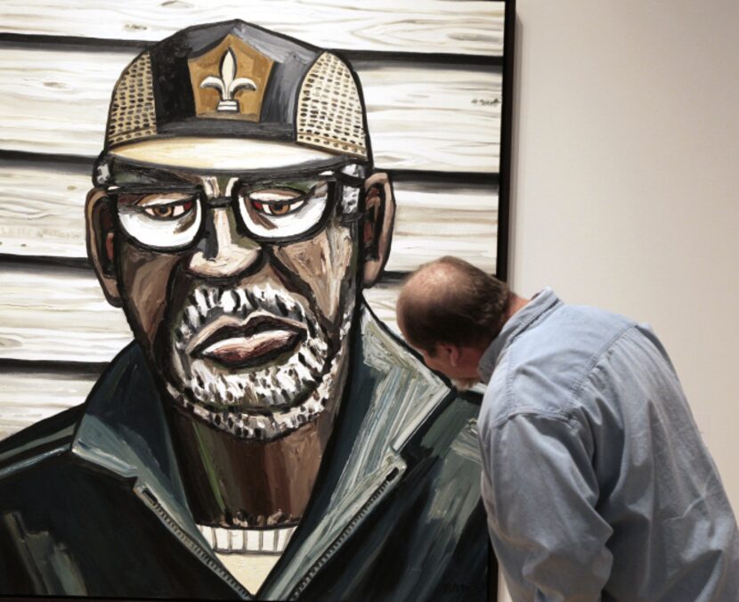 David Mitchell Dillard of Dallas studies the work of Dallas artist David Bates on Wednesday,...