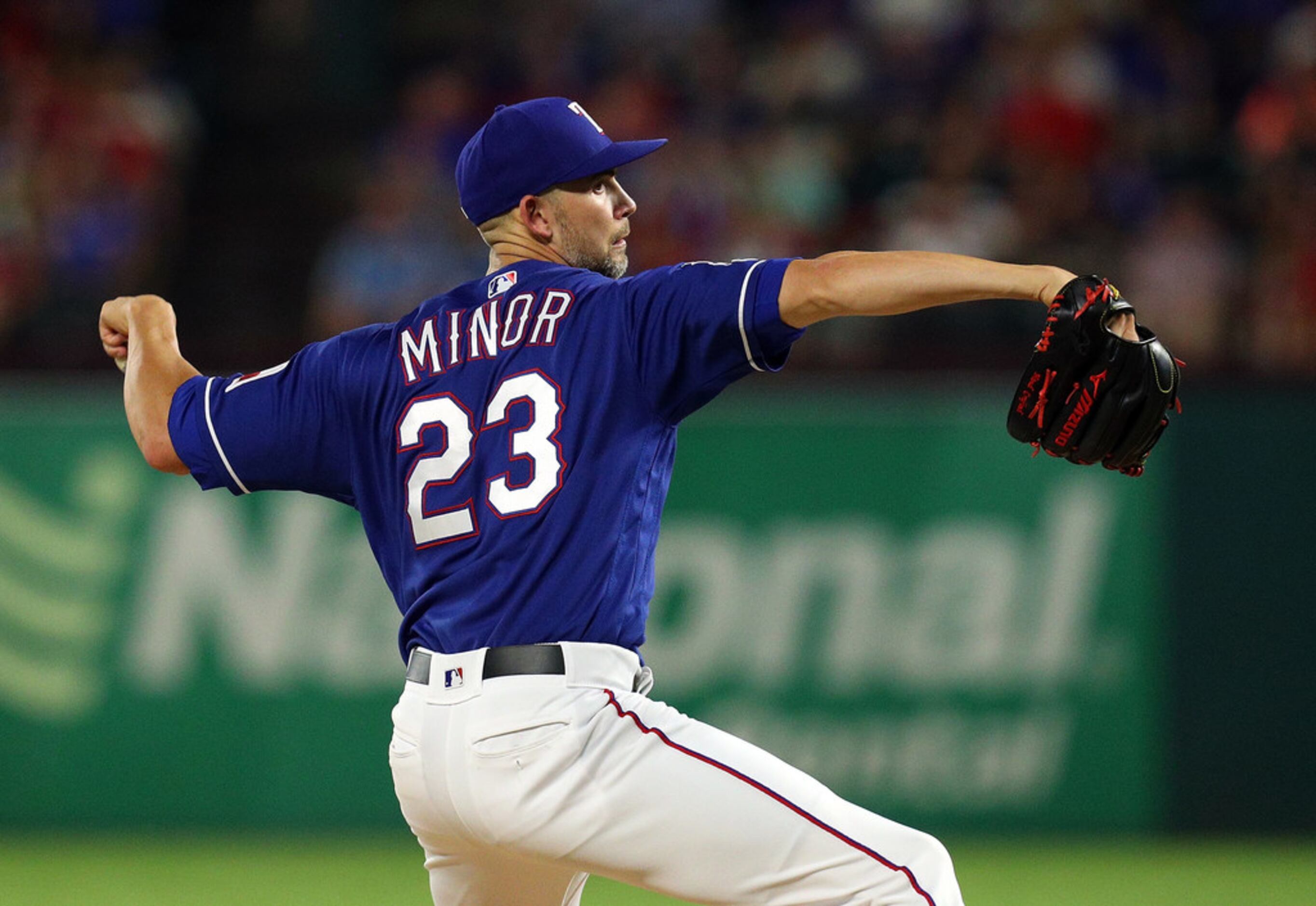 ARLINGTON, TEXAS - SEPTEMBER 14: Mike Minor #23 of the Texas Rangers pitches in the fourth...