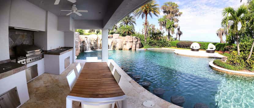 The 31,000 square-foot-home has a lagoon pool and outdoor kitchen.