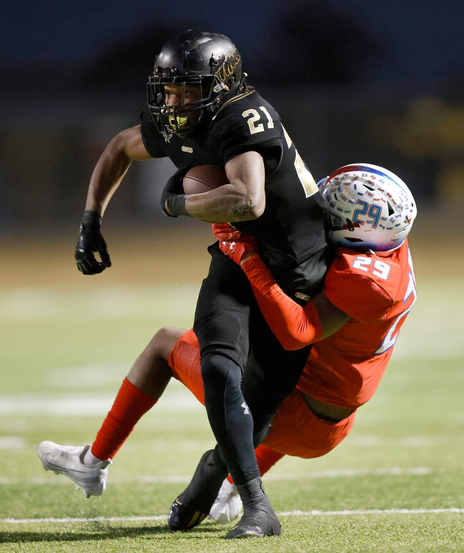 South Oak Cliff running back Danny Green (21) is tackled by Midlothian Heritage linebacker...