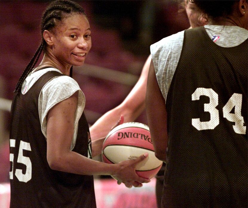 The New York Liberty's leading scorer Vickie Johnson, left, talks to teammate Kym Hampton...