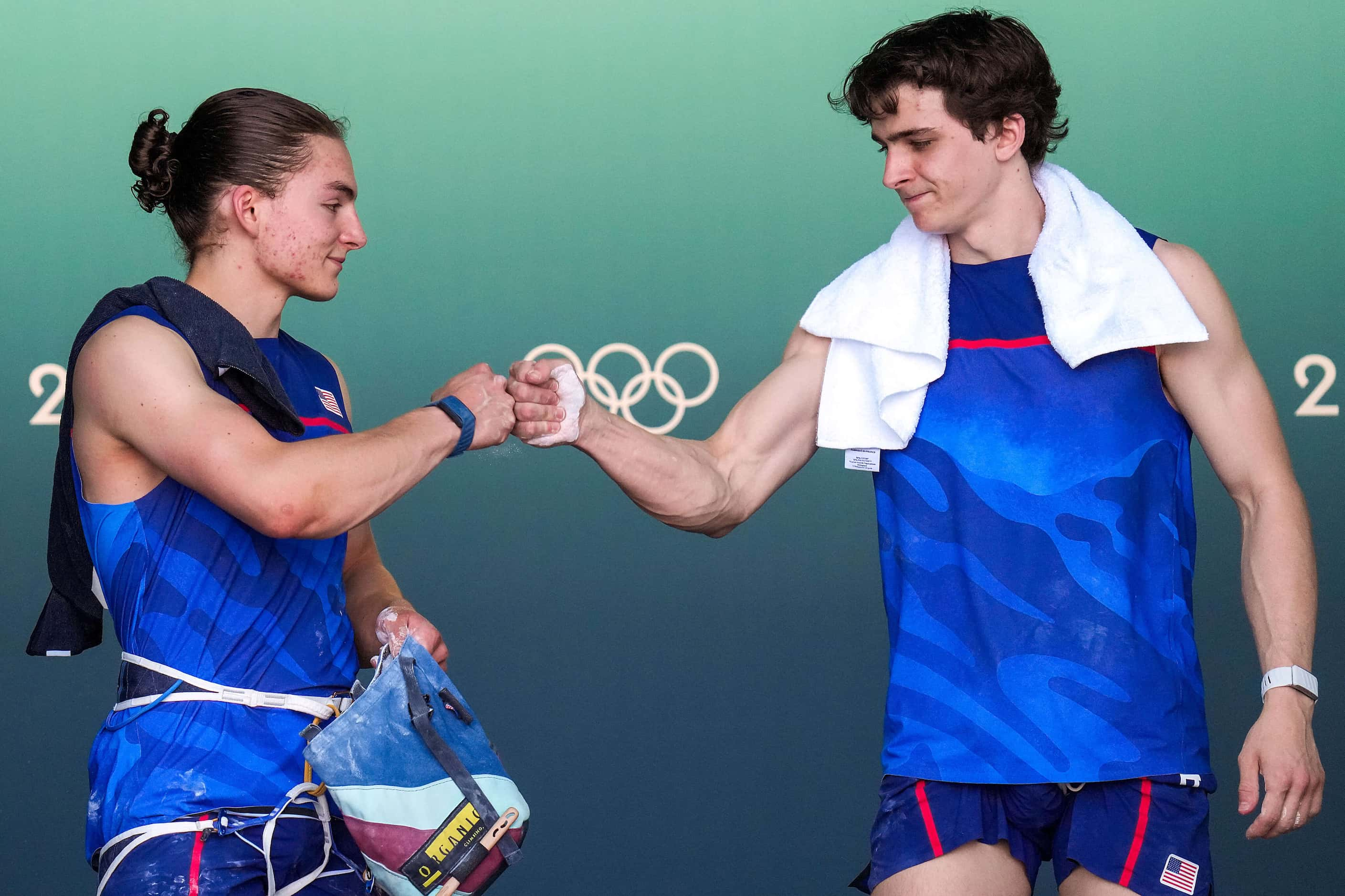 Sam Watson of the United States (right) fist bumps with teammate Zach Hammer before they...