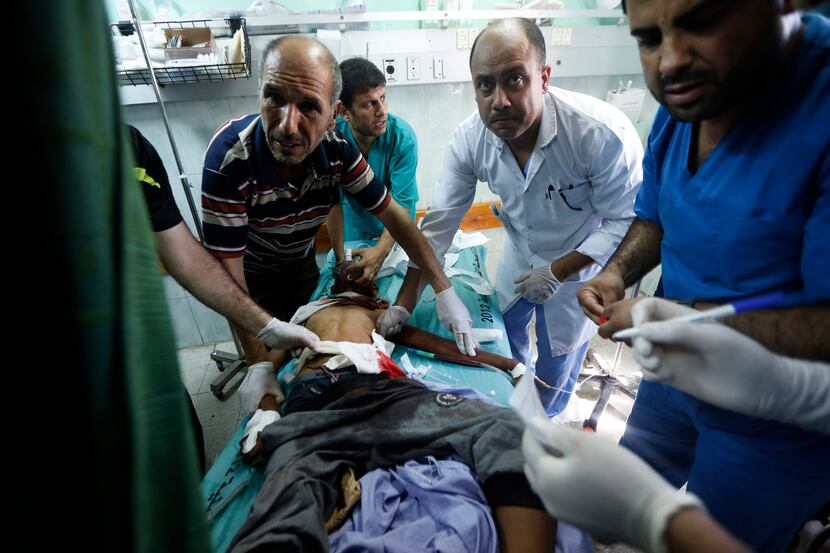 Palestinian medics treated a child wounded in an Israeli strike on a compound housing a U.N....