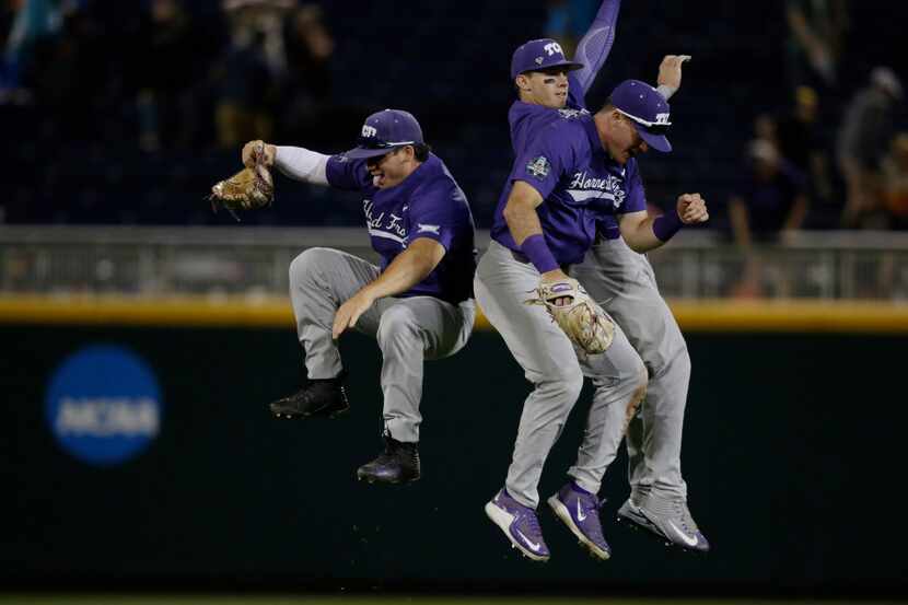 TCU outfielders celebrate following the the team's NCAA College World Series baseball game...