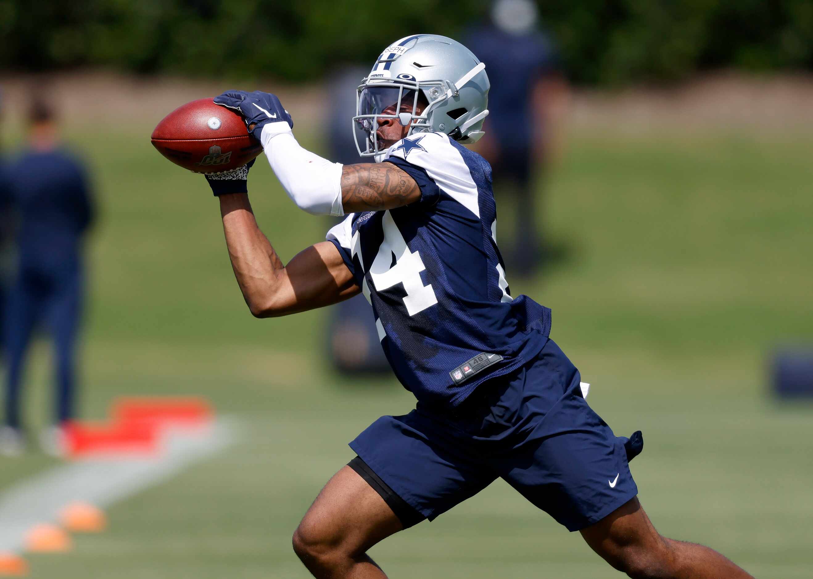 Dallas Cowboys rookie corner back Kelvin Joseph (24) caches a pass during a defensive drill...