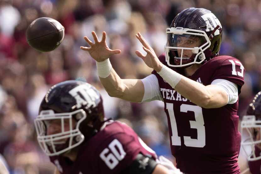 Texas A&M quarterback Haynes King (13) receives a snap during the first half of an NCAA...