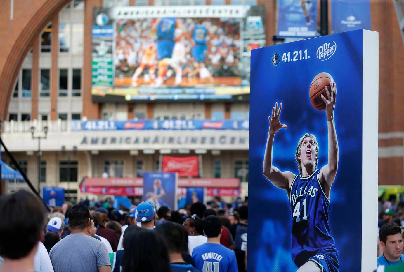 Fans line up to take a portrait at the last home game of the season between the Dallas...