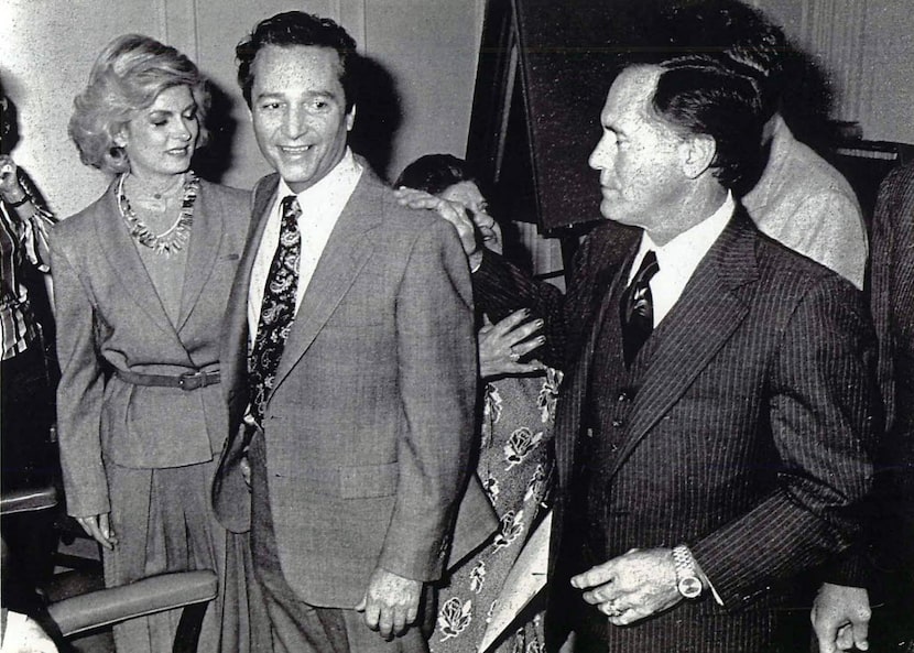 Multimillionaire industrialist T. Cullen Davis (center) receives a pat on the back from...