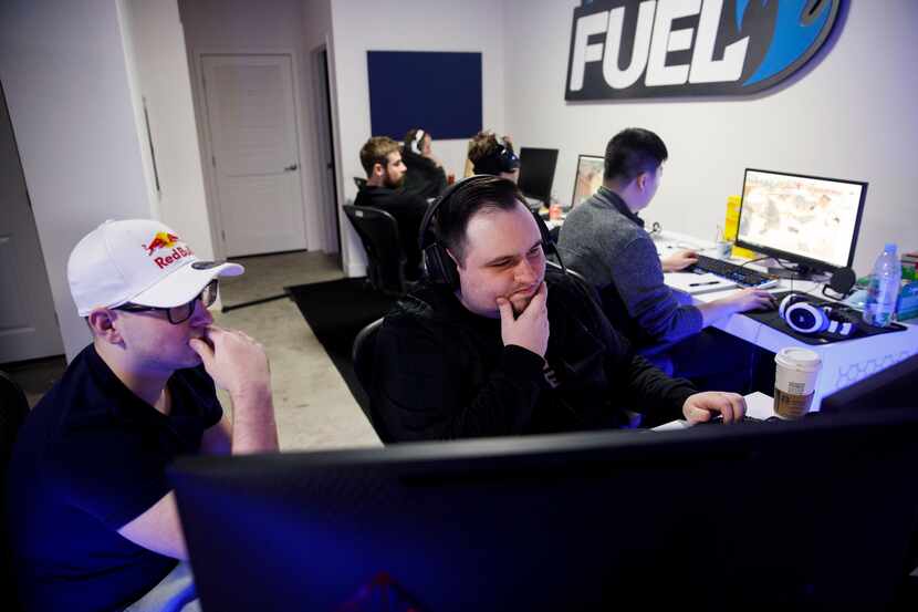 Dallas Fuel head coach Aaron "Aero" Atkins, right, observes his team during a June scrimamge...