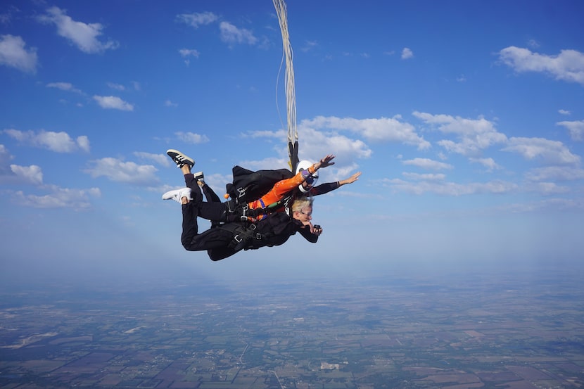 Frazier Elementary School Principal Amy Holderman, below, sky dives on Saturday, Oct. 12, at...