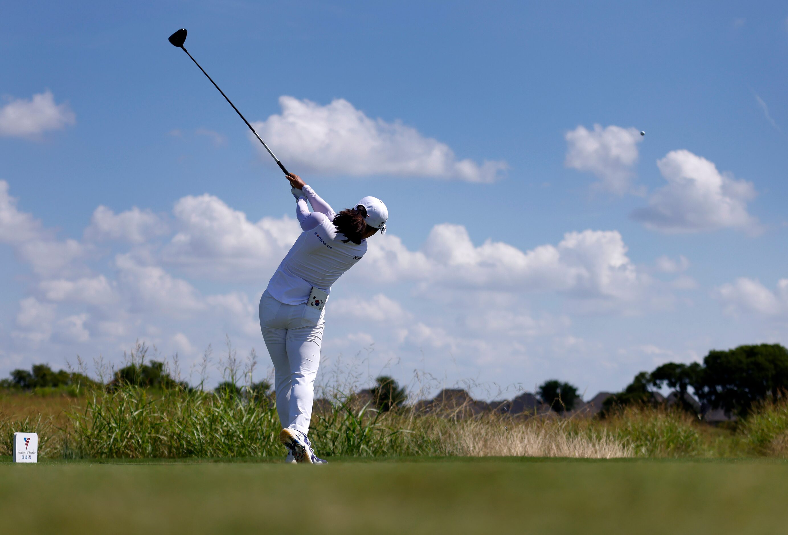 Professional golfer Jin Young Ko hits her drive off the No. 1 tee box enroute to her 8-under...