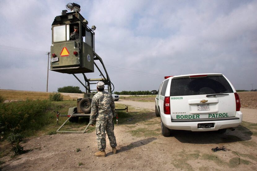 A member of the National Guard checked on his colleague inside a Border Patrol skybox near...