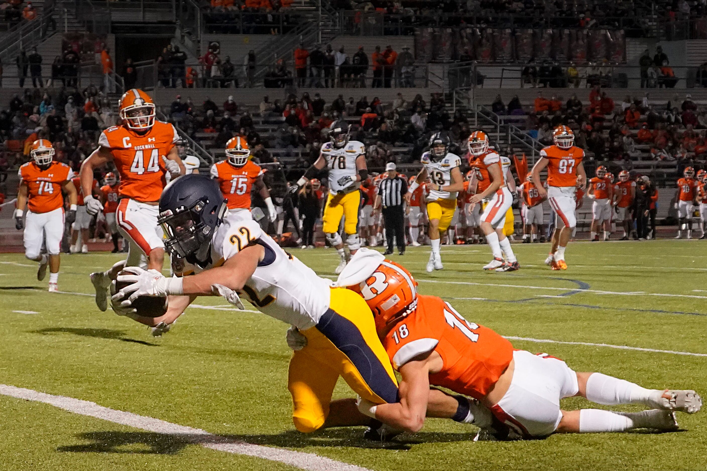 Highland Park running back Brooks Bond (22) scores past Rockwall defensive back Kade Welcher...