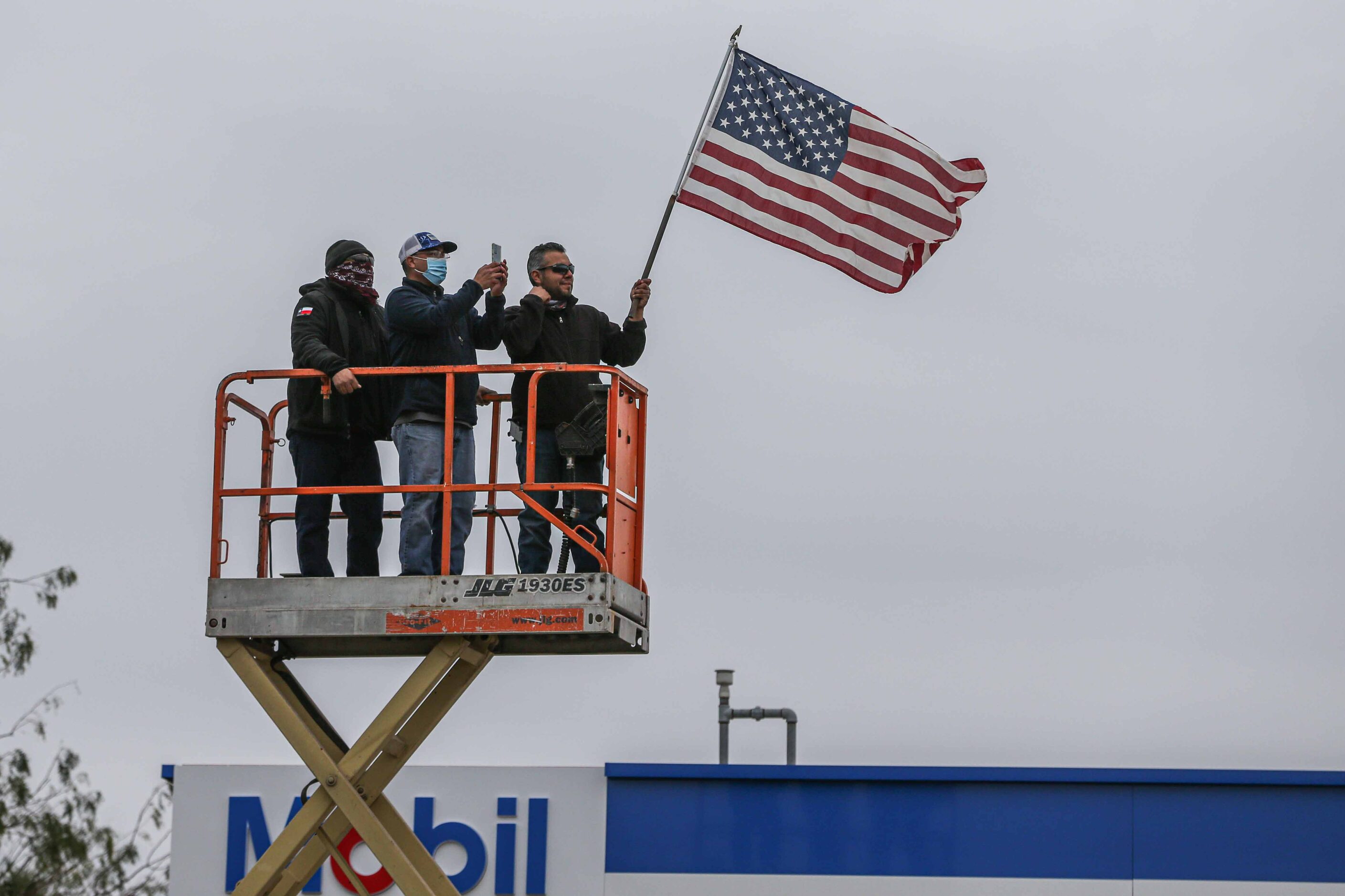 President Donald Trump supporters at S 10th St and Bales Rd during a rally as Trump is...