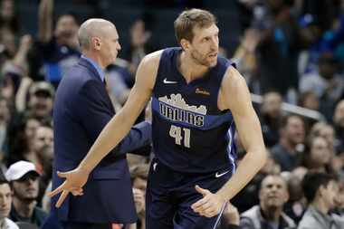 Dallas Mavericks' Dirk Nowitzki (41) reacts after making a 3-point basket during the first...
