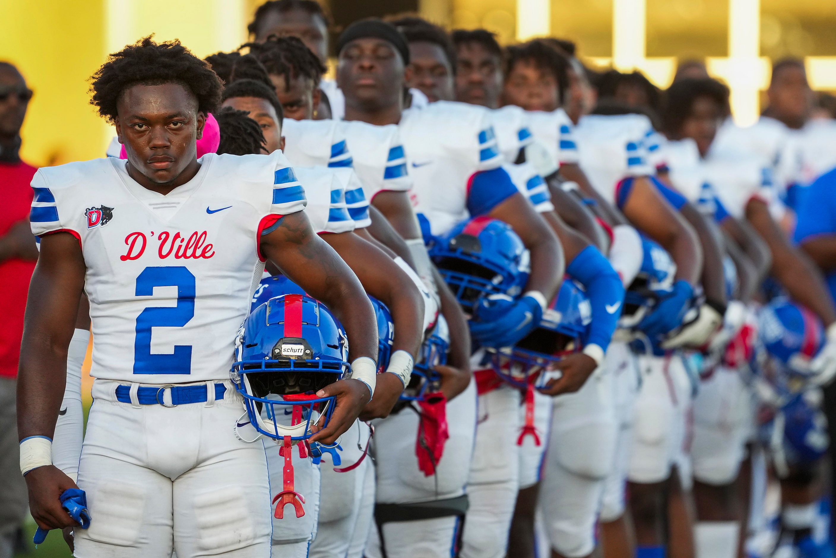 Duncanville linebacker Jordan Crook (2) stands with teammates for the national anthem before...