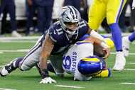 Los Angeles Rams quarterback Matthew Stafford (9) is sacked by Dallas Cowboys linebacker...