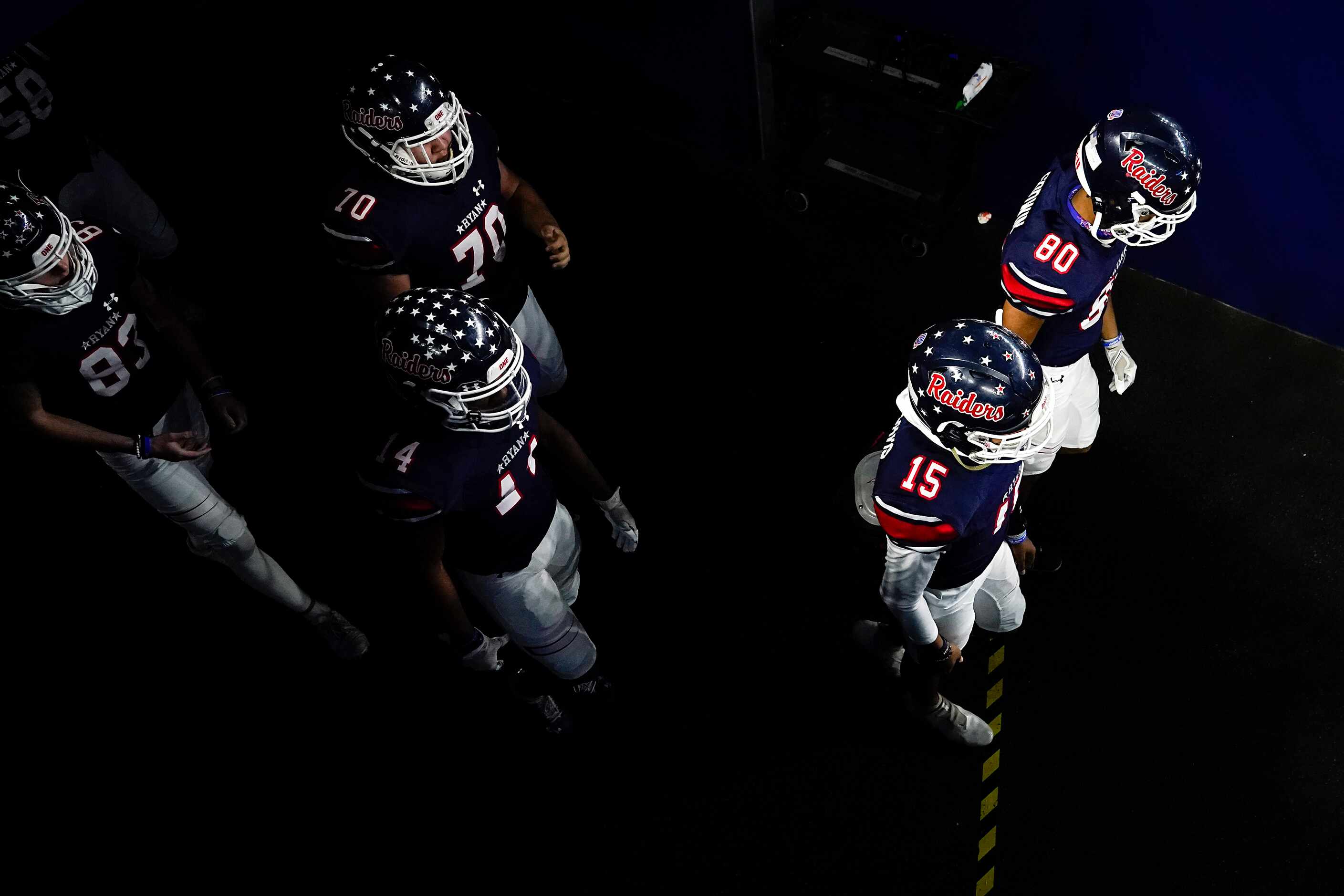 Denton Ryan players take the field to face Cedar Park in the Class 5A Division I state...