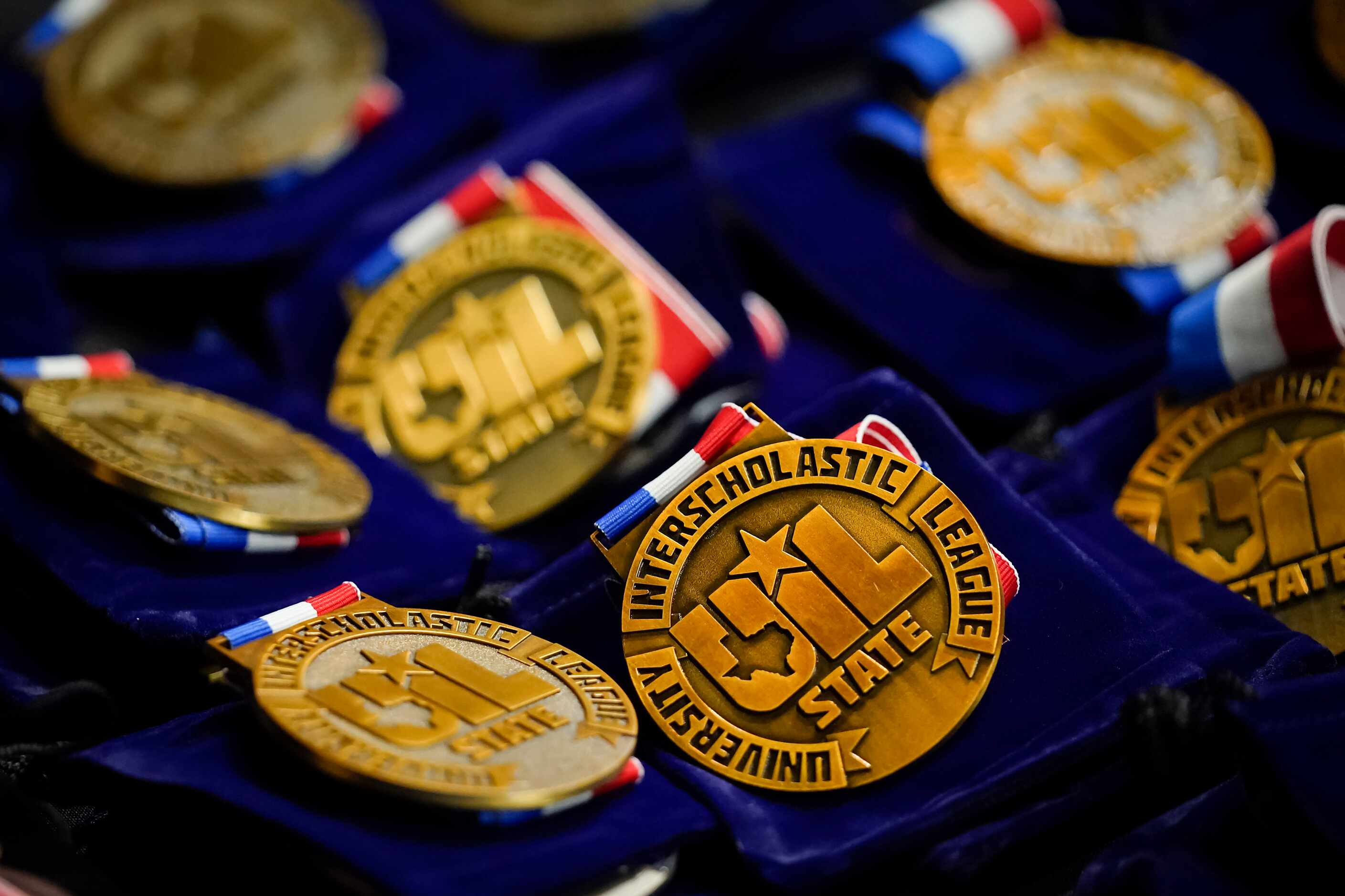 Medals for the 6A championships rest on a table near the awards stand during the UIL State...