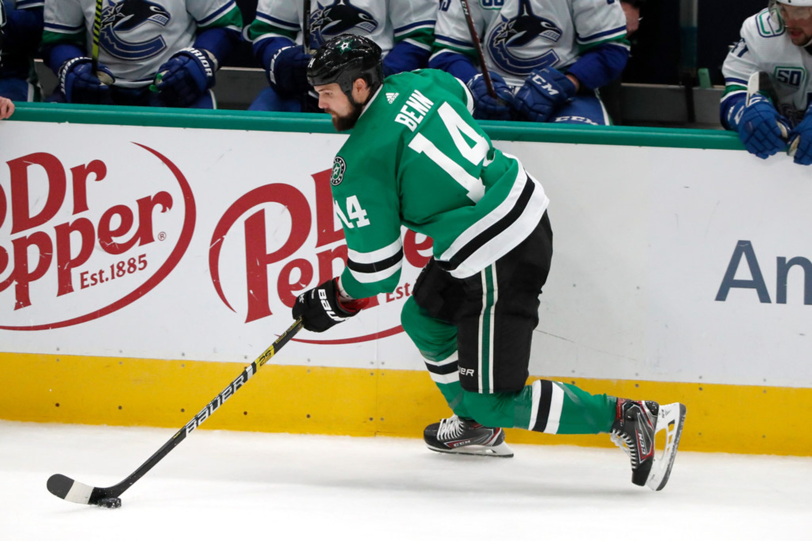 Dallas Stars left wing Jamie Benn (14) moves the puck during the third period of the team's...