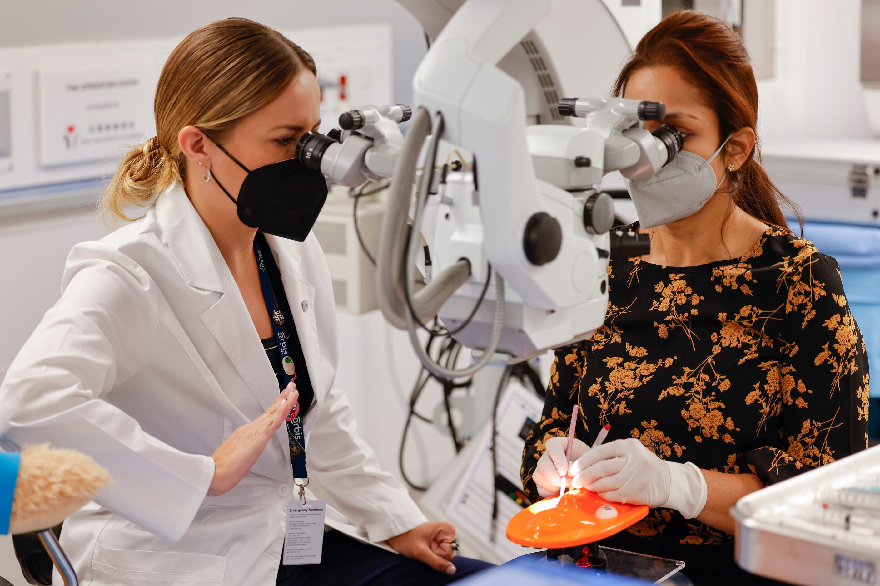 Orbis Flying Eye Hospital instructor Dr. Maria Montero, left, guides resident Ciara...