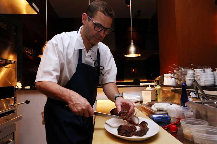 John Tesar prepares food in the open kitchen at Knife