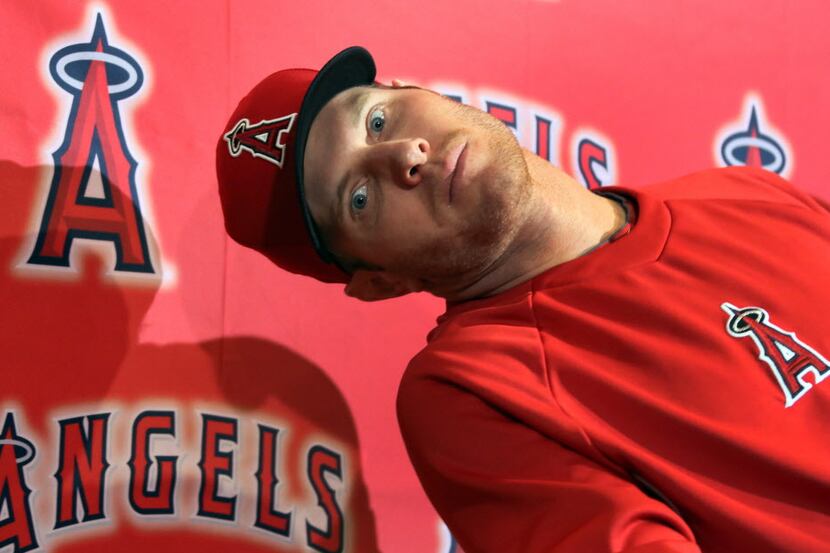 Angels' outfielder Josh Hamilton clowns around during a press conference at the Los Angeles...