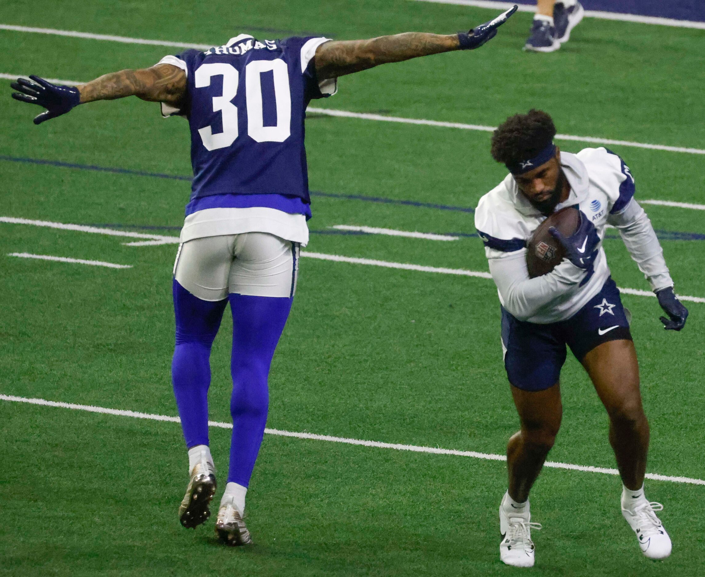 Dallas Cowboys wide receiver Jose Barbon (14) dodges safety Juanyeh Thomas (30) during...