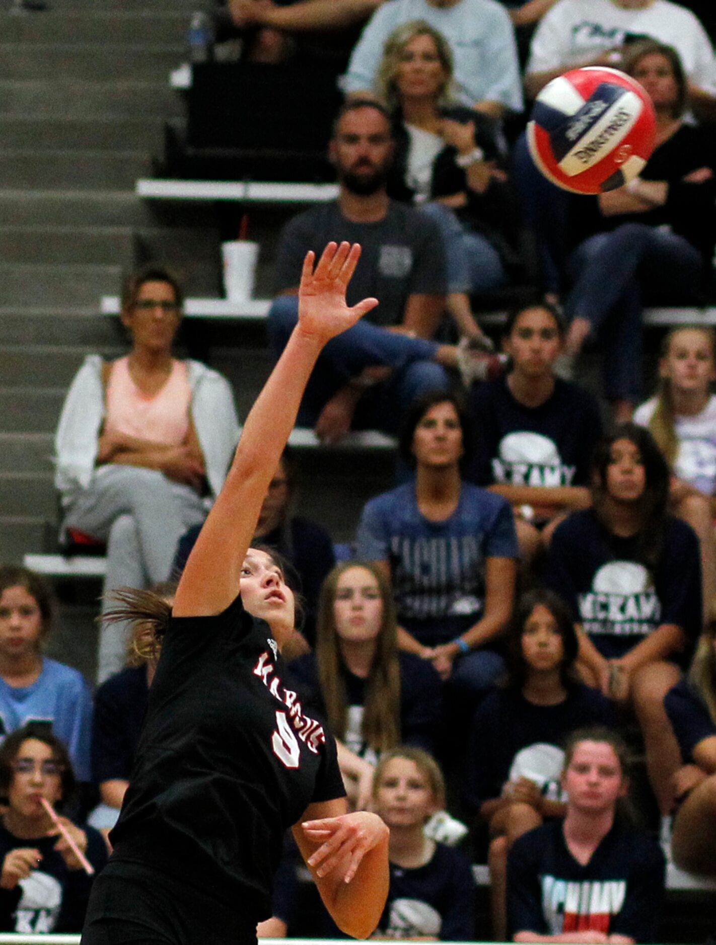 Flower Mound Marcus' Maggie Cox (9) spikes during the first set of their match against...