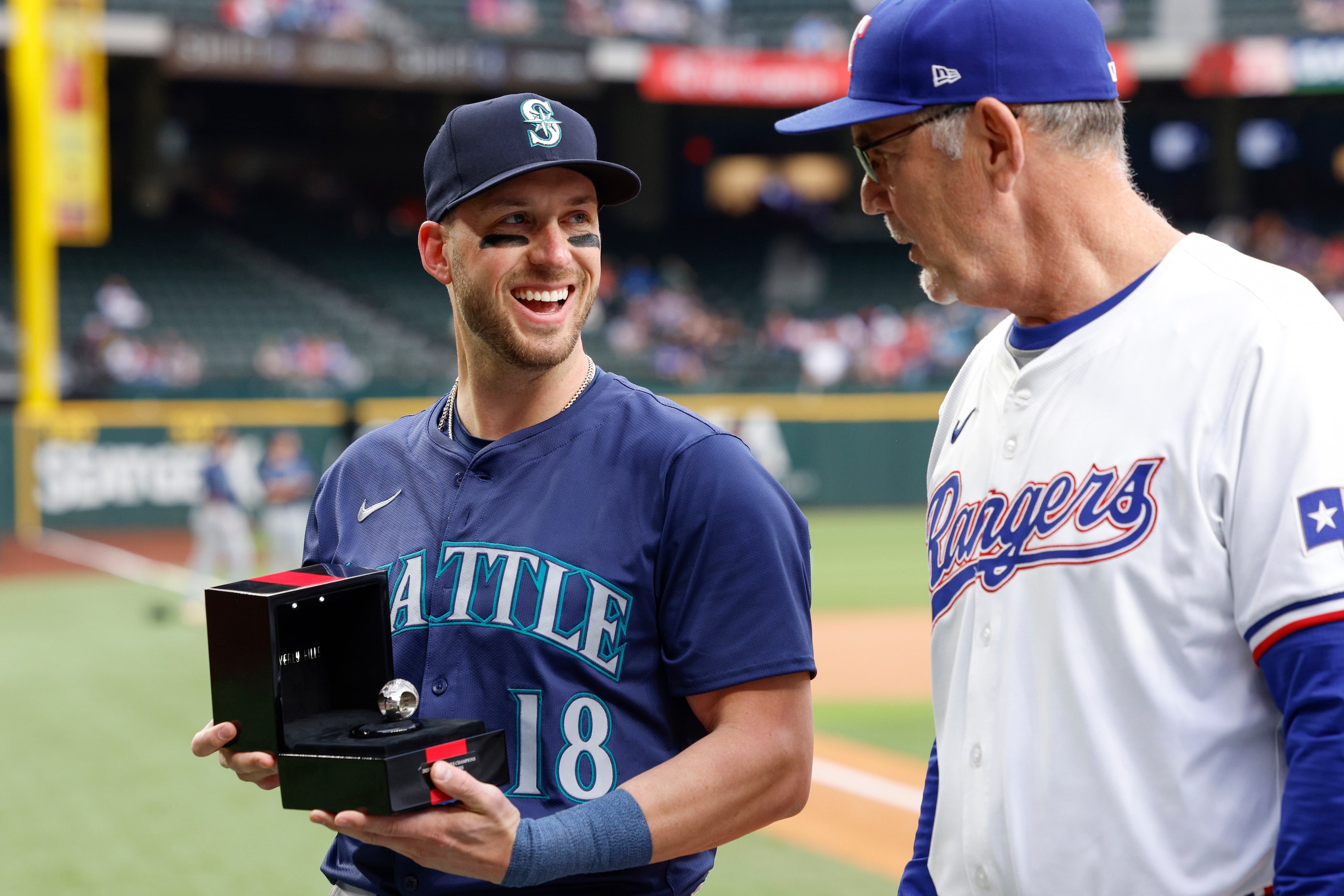 Former Texas Rangers catcher Mitch Garver reacts after seeing his 2023 World Series...