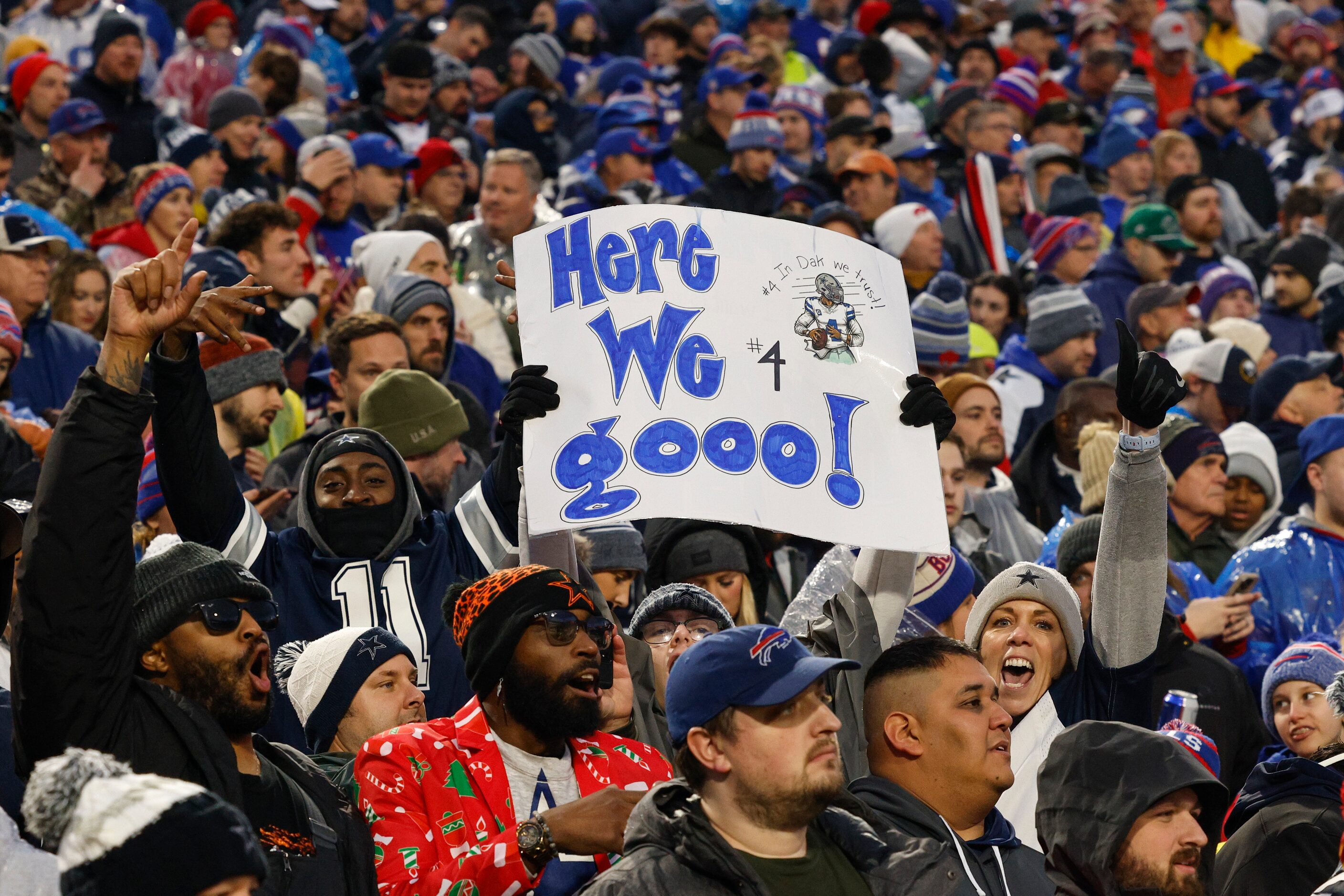 Dallas Cowboys fans cheer during the first half of an NFL game against the Buffalo Bills,...