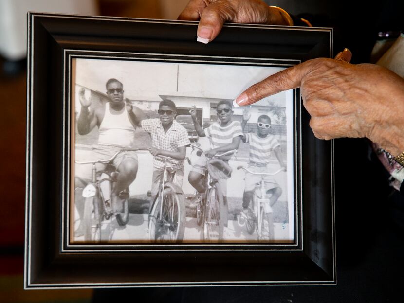 Marion Washington points out her middle son Charles pictured alongside, from left, husband...