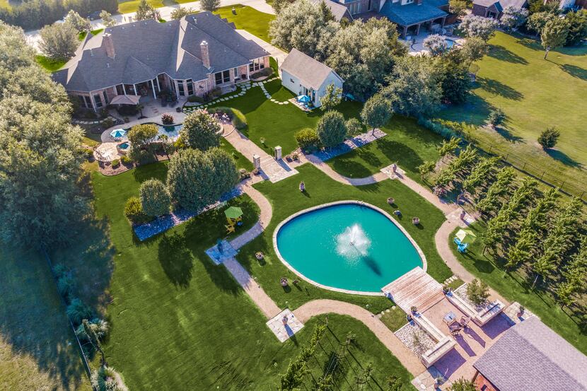 The $1.7 million estate has a private vineyard out back.