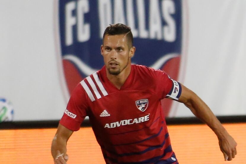 FC Dallas defender Matt Hedges (24) looks for an open team member during first half action...