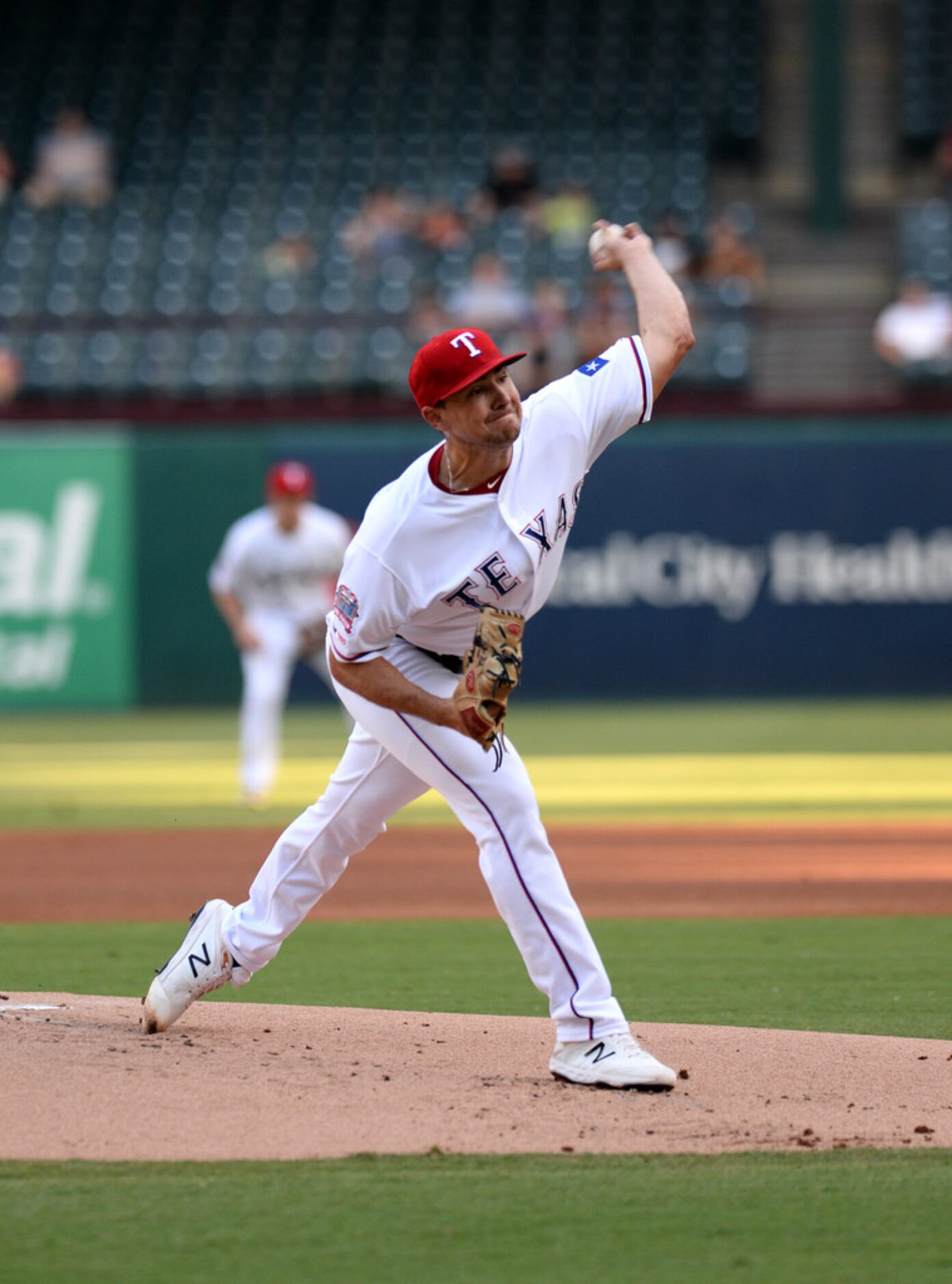 ARLINGTON, TEXAS - AUGUST 20: Brock Burke #70 of the Texas Rangers pitches against the Los...