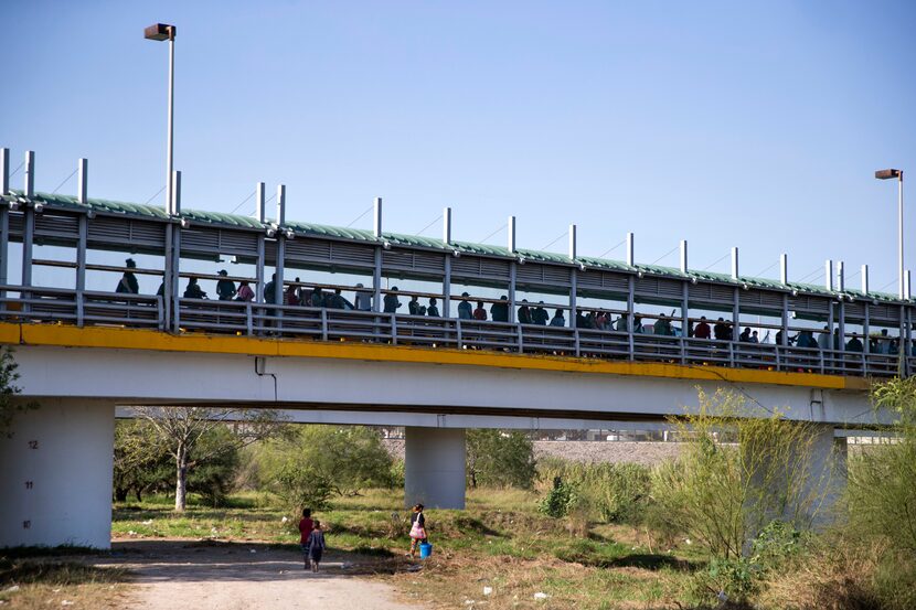 The line for pedestrians to enter the U.S. at the Gateway International Bridge hovers above...