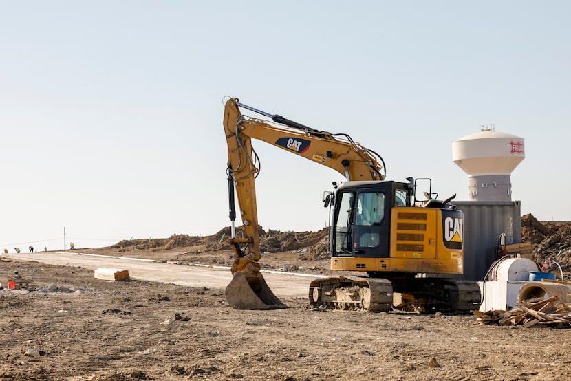 Construction crews are building streets in the 2,500-acre Fields community in Frisco.