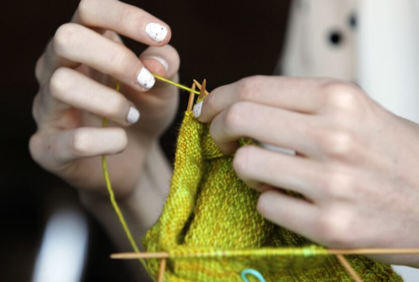 Meredith Crawford knits a sock at The Pearl Cup Monday, August 5, 2013. Crawford, a...