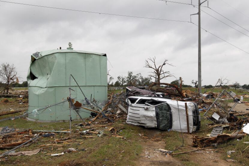 A tornado with winds up to 200 mph Wednesday left debris across the Rancho Brazos...
