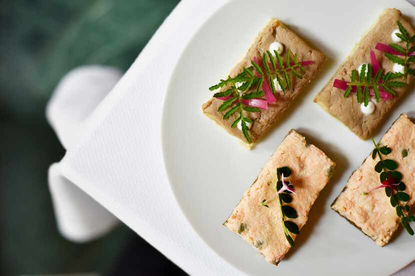 Sandwiches of duck confit with foie gras, top, and salmon rillette with capers, bottom, from...